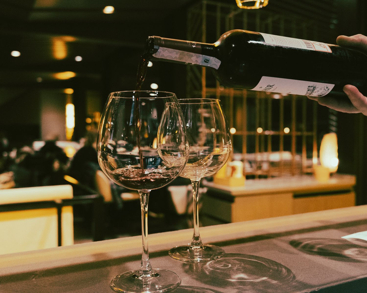 Sommelier pouring wine